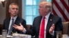 U.S. President Donald Trump (right) speaks during a meeting with NATO Secretary-General Jens Stoltenberg at the White House on May 17.