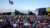 People participate in a protest in front of the prime minister's office in Bucharest on June 20.