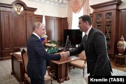 Владимир Путин и сын Николая Патрушева Дмитрий в Кремле. 11 сентября 2019 года.
