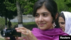 Malala Yousafzai, the 14-year-old schoolgirl targeted in the October 9 gun attack, is seen in Swat Valley in an undated photo.