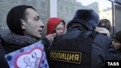 Gay-rights activists hold a protest outside the State Duma in January as a new law against disseminating "homosexual propaganda" to minors was being debated by Russian legislators.