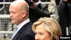 U.K. Foreign Secretary William Hague (left) and his U.S. counterpart Hillary Clinton arrive for talks in London on March 29.