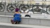 Turkmenistan. Woman cleaning, Abadanchylyk street (before Moskovskaya) in Ashgabat. March 2019