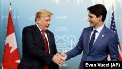 Donald Trump i Justin Trudeau tokom sastanka G7, Kanada, 8. juni 2018.