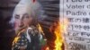 Pakistanis burn a poster of George Washington during a demonstration in Quetta following the massacre of 16 Afghans allegedly by a U.S. soldier. (Reuters/Naseer Ahmed)