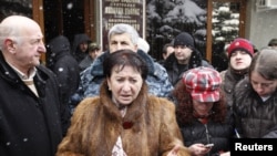 Disqualified presidential candidate Alla Dzhioyeva speaks to the media outside South Ossetia's central election commision building in Tskhinvali on November 30.