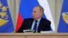 Russian President Vladimir Putin attends a meeting of the Prosecutor-General's Office in Moscow on March 17.
