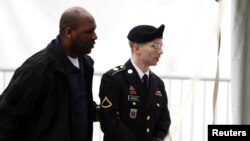 U.S. Army Private First Class Bradley Manning (right) arriving at the courthouse for a motion hearing at Fort Meade in Maryland in late May.