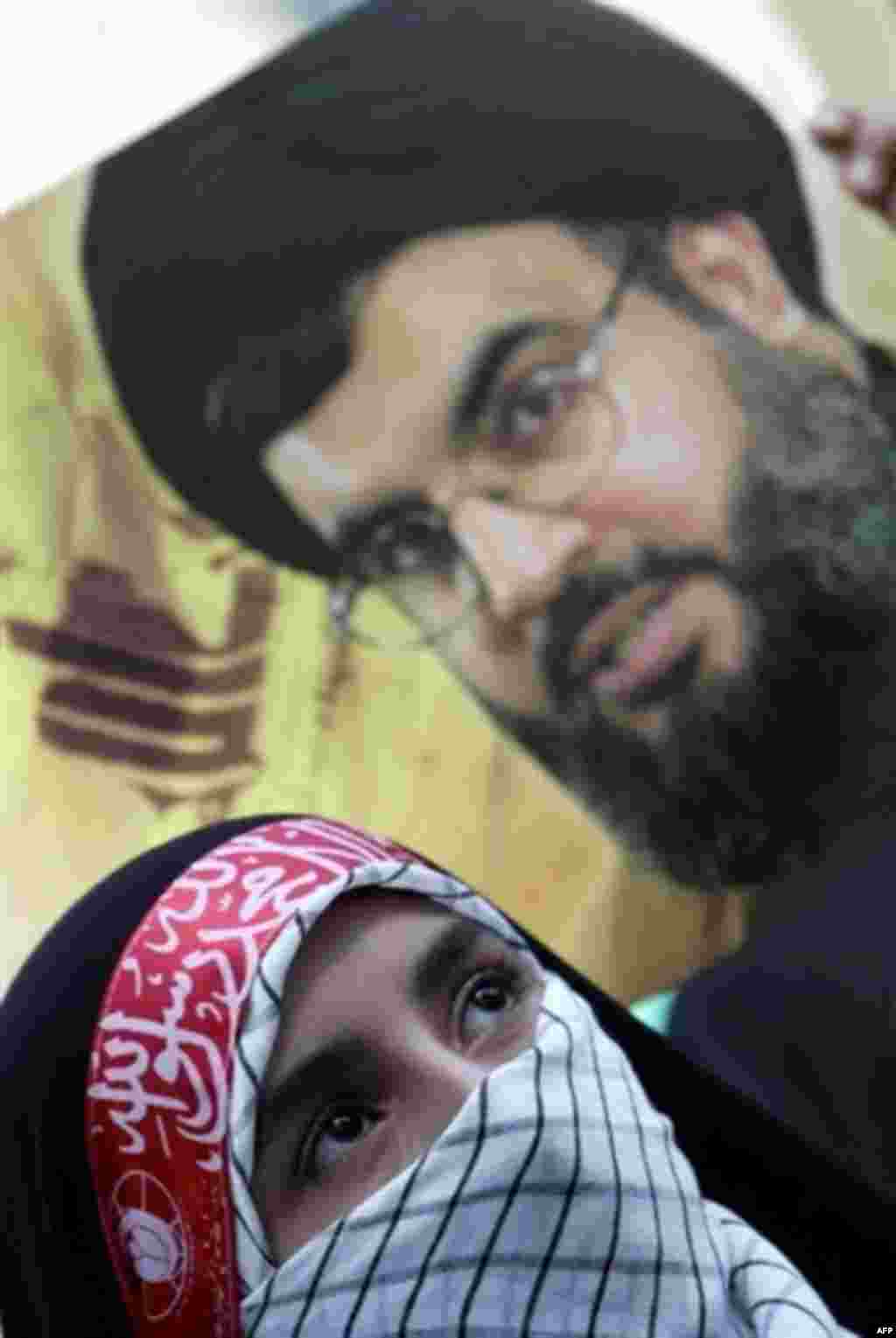 An Iranian woman at a rally in support of Lebanon and the leader of the Hizballah militia, Hassan Nasrallah (AFP) - Concern about Iran's nuclear program dominated the headlines for much of the year, but its power to influence events in Iraq and in Lebanon also prompted speculation and concern. The war in Lebanon added to a sense that Iran's power in the region was increasing, with the Tehran-backed militia group Hizballah resisting Israeli military power more successfully than almost anyone expected.