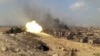 A Syrian Army tank fires during a battle against Islamic State militants in Deir al-Zor in Novemeber.