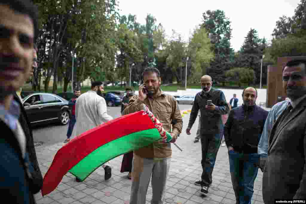 A man carries a Belarusian flag, which might help the delegation find one another among the&nbsp;crowds. Nearly 2 million Muslims will take part in the hajj. 