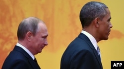 Relations between Russian President Vladimir Putin (left) and U.S. President Barack Obama have gone ice-cold since Washington and its allies accused Russia of conducting a covert war on Ukraine, beginning with its occupation and unrecognized annexation of Crimea a year ago.