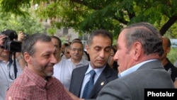 Ex-Foreign Minister Aleksandr Arzumanian (left) is greeted by opposition leader Levon Ter-Petrossian after the former's release from custody on July 22.