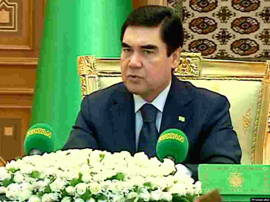 Berdymukhammedov at a cabinet meeting. The Turkmen president is frequently shown against a foreground of white roses, and is even the subject of an adulatory poem entitled "White Roses."