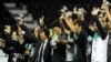 South Korean players and coach Cho Kwang-Rae (C) celebrate after beating Uzbekistan in their 2011 Asian Cup football match for third place at Al-Sadd Stadium in the Qatari capital Doha on January 28, 2011