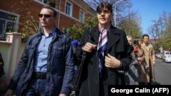 Laura Codruta Koevesi (right), former chief prosecutor of the National Anticorruption Bureau (DNA), arrives at a police station in Bucharest on March 29.