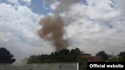 Smoke rises from the Afghan parliament building in Kabul on June 22.