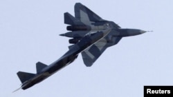 Sukhoi T-50 jets fly during a display at the opening of the MAKS International Aviation and Space Salon at Zhukovsky airport outside Moscow in 2011.