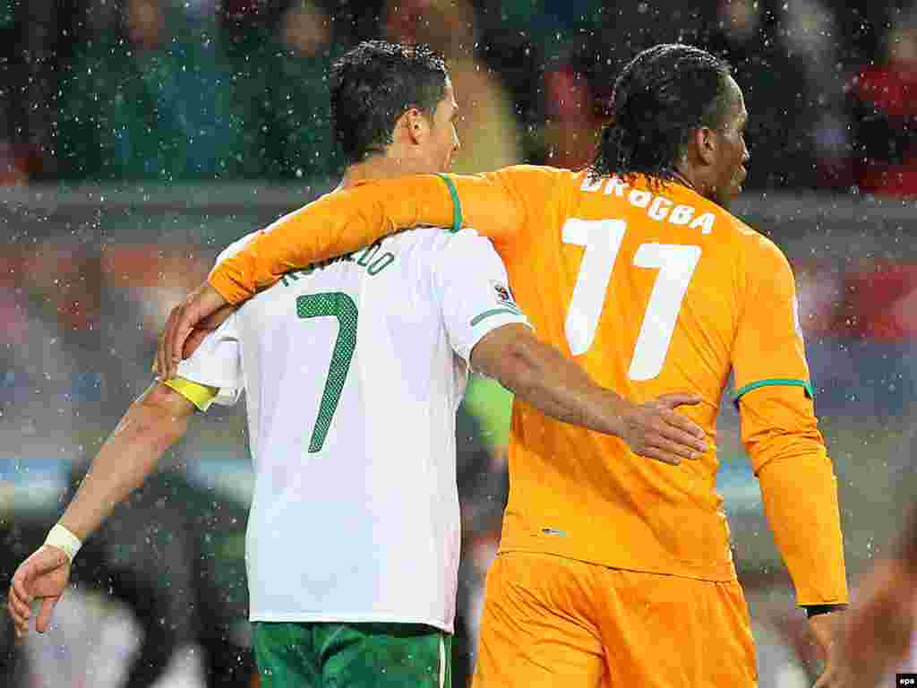 South Africa -- Ivory Coast striker Didier Drogba (R) and Portugal's Cristiano Ronaldo (L) during the FIFA World Cup 2010 match between Ivory Coast and Portugal at the Nelson Mandela Bay stadium in Port Elizabeth, 15Jun2010 - epa02203480 Ivory Coast striker Didier Drogba (R) and Portugal's Cristiano Ronaldo (L) during the FIFA World Cup 2010 group G preliminary round match between Ivory Coast and Portugal at the Nelson Mandela Bay stadium in Port Elizabeth, South Africa, 15 June 2010. EPA/ROBERT GHEMENT Please refer to www.epa.eu/downloads/FIFA-WorldCup2010-Terms-and-Conditions.pdf 