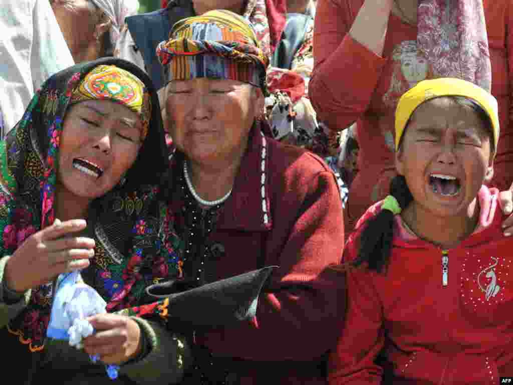 Relatives grieve during the funeral of a victim of violent clashes in southern Kyrgyzstan, where the interim government retook official buildings from backers of the ousted government. Photo by Vyacheslav Oseledko for AFP