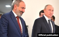 Armenian Prime Minister Nikol Pashinian (left) and Russian President Vladimir Putin in Yerevan in October 2019. “This enhanced Russian leverage will...keep Armenia well within the Russian orbit," one analyst says.