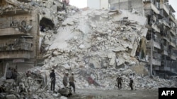 Разрушенные здания в Алеппо.