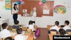 There are reports of teachers in rural Kazakh schools receiving their salaries late and in several small, random portions. (file photo)