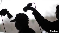 A man is tested for possible nuclear radiation at an evacuation center in Fukushima.