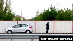 Turkmenistan. weekly 19th week. A trafic police is looking to road movements