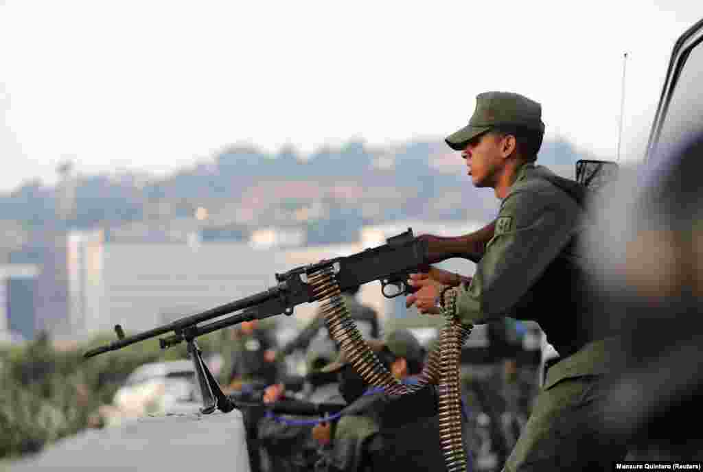 A uniformed man with a heavy machine gun. In a video posted on Twitter, Guaido said. &ldquo;The national armed forces have taken the correct decision, and they are counting on the support of the Venezuelan people.&rdquo;&nbsp;