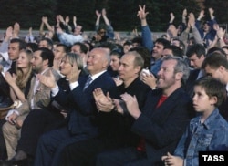 Makarevich (second right), rocks out with Vladimir Putin (third right) at Paul McCartney's 2003 concert in Moscow.