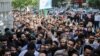 People waiting outside of one of the main voting stations in Tehran, to cast their ballot on Friday May 19, 2017.