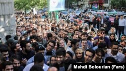 FILE Photo - People waiting outside of one of the main voting stations in Tehran, to cast their ballot on Friday May 19, 2017.