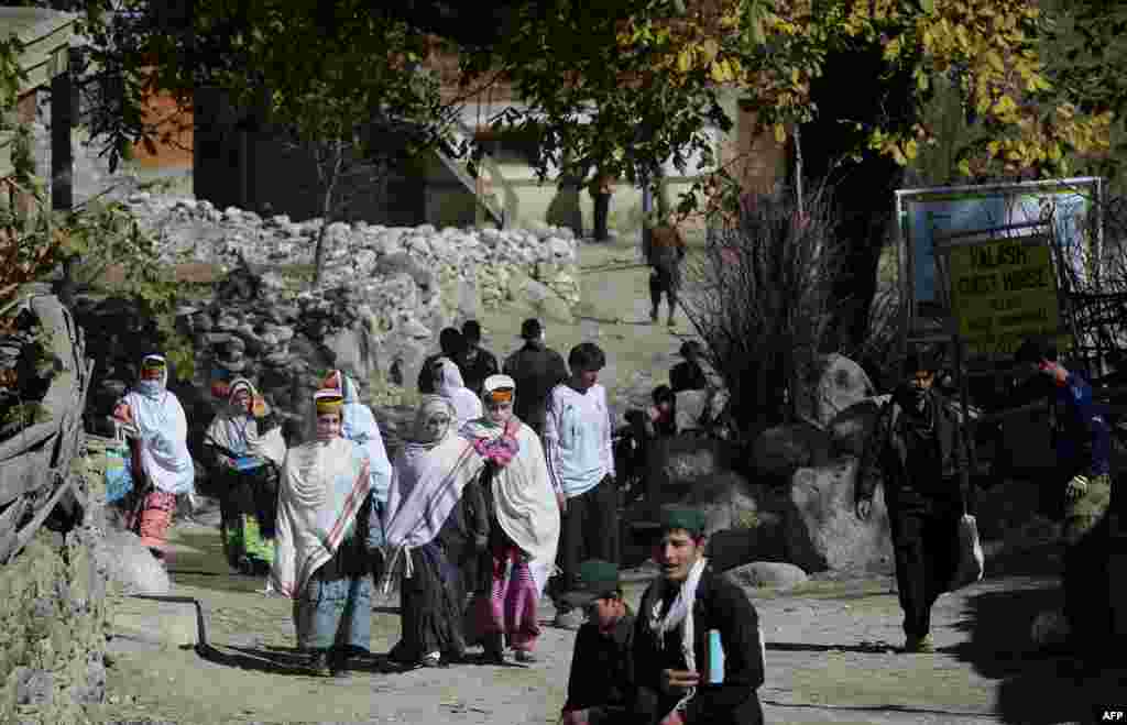 The Kalash are the last survivors of the people of Kafiristan -- or Land of Unbelievers, an area that encompassed northwest Pakistan and eastern Afghanistan before the region was divided by the Durand Line, the border established between Afghanistan and British India in the 19th century. The Kalash in Pakistan share close cultural and linguistic links with their kin in Afghanistan known as Nuristanis, who live mostly in the eastern province of Nuristan. The inhabitants of Kafiristan were repeatedly targeted by successive Afghan kings who ransacked the area and forced locals to convert to Islam. The name of the area was subsequently changed to Nuristan, which means land of the enlightened. The Kalash, who remained in British India and then Pakistan, were shielded by the border.