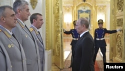 Russia's President Vladimir Putin calls for crackdown during meeting with military officers at the Kremlin on June 7.