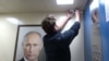 Russia - YouTuber Bashir Dokhov hung a portrait of Vladimir Putin in a Moscow elevator and recorded people's reactions. screen grab