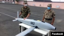 Armenia -- Armenian officers demonstrate an Israeli-made "suicide" drone SkyStriker which they say was intercepted during fighting with Azerbaijani forces, July 24, 2020.