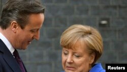 British Prime Minister David Cameron and German Chancellor Angela Merkel have been criticized for allowing economic issues to keep them from punishing Russia for its intervention in Crimea.