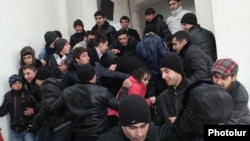 Armenia - Pro-government youths prevent journalists from covering the supposedly public defense of Yerevan Mayor Taron Markarian's doctoral thesis, Yerevan, 26Dec2013.