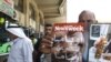 A man shows the Arabic copy of Newsweek magazine ahead of U.S. President Barack Obama trip to the Middle East.
