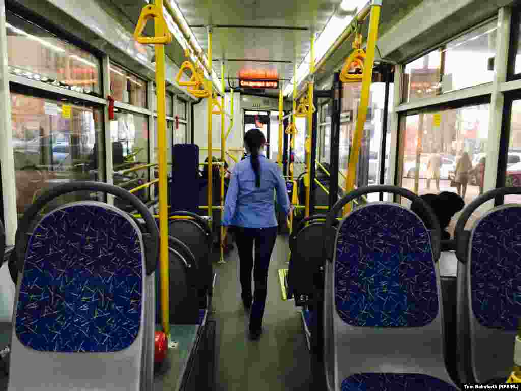 Inside one of Moscow&#39;s sleek modern trolleybuses, a driver walks up the aisle to check her vehicle. This picture was taken in 2016, amid rumors that some trolleybus routes would be finished overnight.&nbsp;