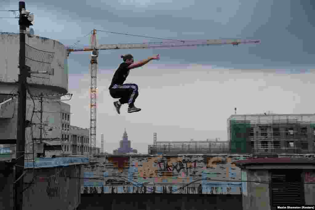 Vad Him jumps on a rooftop in Moscow.