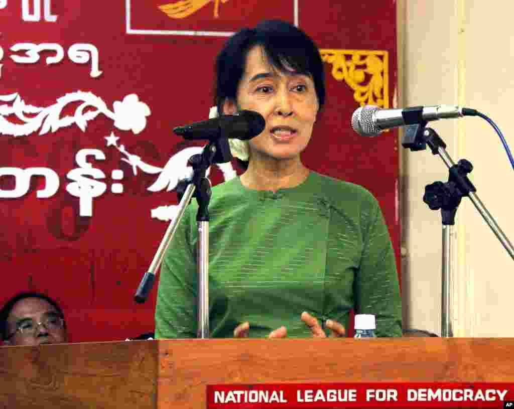 The pro-democracy activist talks to her party's youth members during a journalism workshop in Yangon in May 2011.