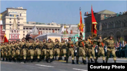 Kyrgyz soldiers march in a parade in Moscow on Red Square.