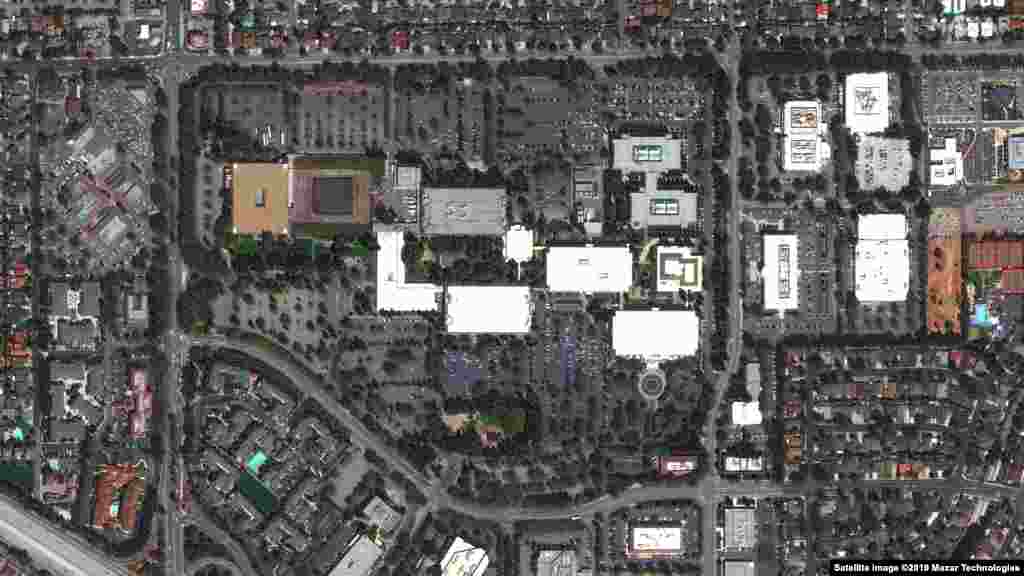 These images show the evolution of technology firm Apple's headquarters -- called Apple Park -- in Cupertino, California. The before image shows the former Hewlett Packard campus in 2012 followed by the construction of 260,000 square meters of new office space in Apple Park, the landscaping of about 71 hectares and regular operations in 2019. The images were taken on August 30, 2012 and September 2, 2019.
