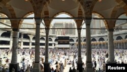 Muslim pilgrims circle the Kaaba at the Grand mosque in Mecca on September 8.