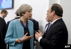 Британский премьер Тереза Мэй и французский президент Франсуа Олланд обсуждают будущее ЕС без Соединенного Королевства