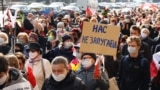 Pensioners and students protest in Minsk on October 26, 2020, carrying a sign reading, "You can't frighten us."