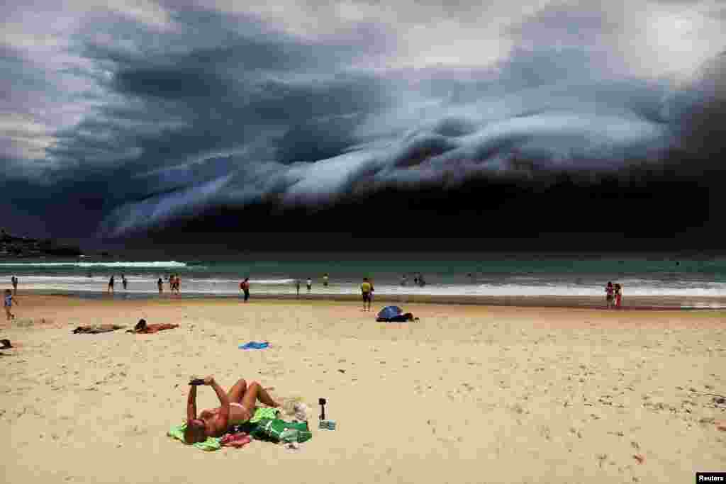 First Prize Singles in the Nature category was won by Australian Rohan Kelly for this photo of a sunbather oblivious to the ominous shelf cloud approaching her on Bondi beach. (November 6, 2015)