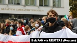 Students attend an opposition rally to reject the presidential election results, near the Belarusian State University in Minsk on October 26, 2020.